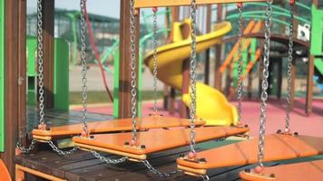 Hanging bridge on the chains swinging on the playground video