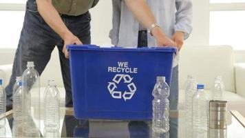 Couple fills recycle bin, closeup video