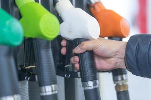 Fuel pump nozzles for different kinds of fuel in a filling station photo