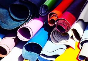 Assorted colored rolled fabrics photo