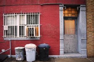 Trash bins outside of apartment number 108 photo