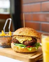 Vegetarian veggie burger with french fries photo