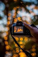 DSLR Camera on Bokeh Background Black DSLR Camera With Bokeh Lights Photo and Camera City Lights Bokeh