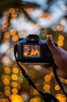 DSLR Camera on Bokeh Background Black DSLR Camera With Bokeh Lights Photo and Camera City Lights Bokeh