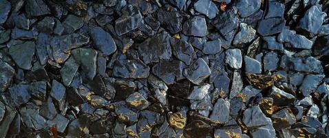 The wet rocks and stone texture pattern background photo