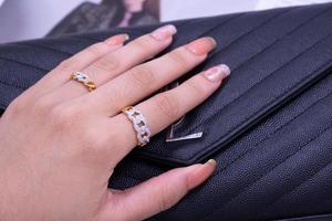 Diamond ring on hand fingers photo