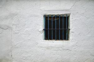 window on the old facade of the house photo