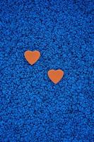 red hearts shape on the blue background photo