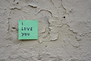 I love you message written on a paper photo