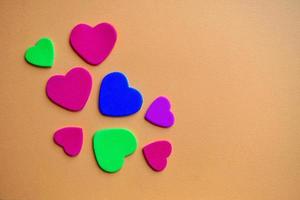 colorful hearts shape on the orange background photo