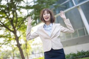 Attractive asian business woman Cheerful in Outside Office photo