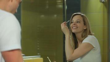 Couple in bathroom getting ready for day video