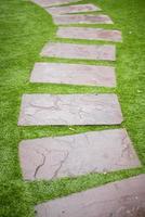 Stone walkway in green lawns