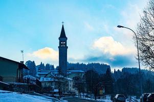 Blue village with clouds and a church photo