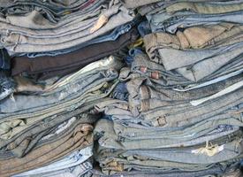 A stack of old blue jeans photo