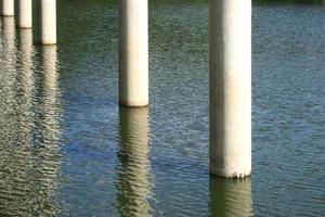 Concrete piles in water photo