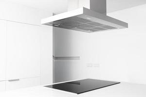 View of a cooker hood and electric stove of a modern and minimalist kitchen photo