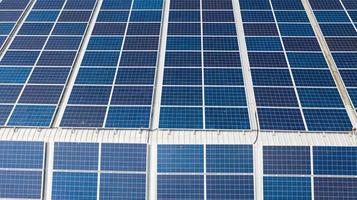 Aerial top view of the solar cells on the roof photo