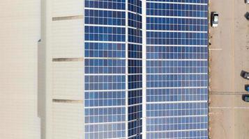 Aerial top view of the solar cells on the roof photo