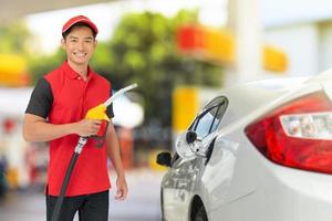 Portrait of Gas station worker and service photo