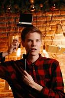 Handsome guy posing with top hat and pipe photo booth attributes