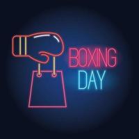 venta de boxing day luces de neón con guante y bolsa de compras. vector