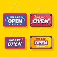 we are open labels hanging on yellow background vector