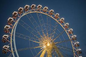 Ferris wheel in a night park entertainment in the park photo