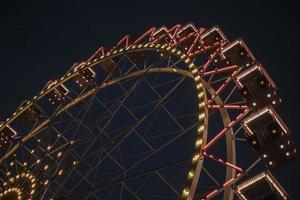Ferris wheel in a night park entertainment in the park photo