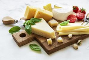 Various types of cheese and snacks photo