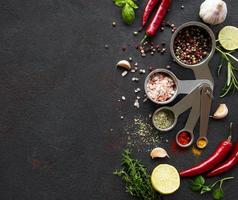 Variety of colorful spices in spoons photo