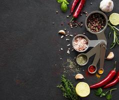 Variety of colorful spices in spoons photo