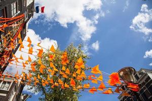 The Netherlands flag and decorations on King's day in Amsterdam photo