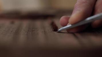 Close Up Woodcarver Cuts the Mahogany Board with a Chisel and Makes a Pleasant ASMR Soun video