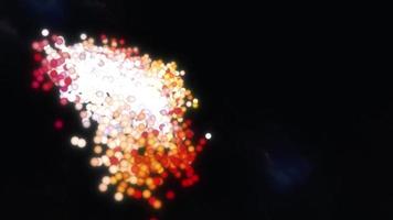 Many glowing particles transform into spiral galaxy animation video