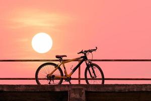 Beautiful mountain bike on concrete bridge photo