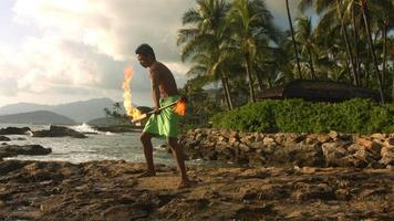Hawaiian fire knife dancer performs video