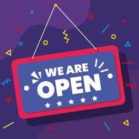 we are open label hanging on purple background vector
