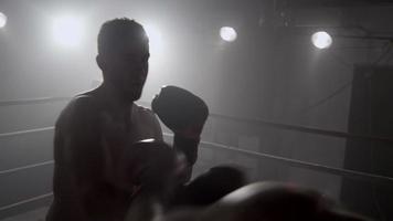 Boxer punching in boxing ring, POV video