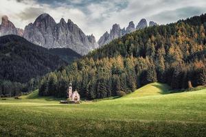 The scenery of the Dolomites with the St Johns in Ranui Chapel in Santa Maddalena  Italy