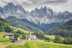 Santa Maddalena village with beautiful Dolomites mountains in the background Val di Funes valley Italy photo