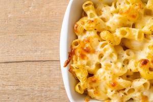 American mac and cheese macaroni pasta in cheesy sauce photo