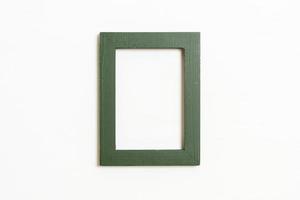 Empty picture frame on white wall background with copy space photo