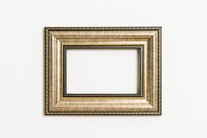 Empty picture frame on white wall background with copy space photo