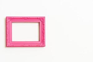 Empty picture frame on white wall background with copy space photo