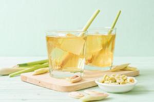 Iced lemon grass juice on a wood background photo