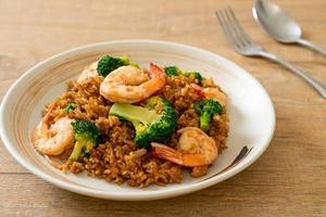 Fried rice with broccoli and shrimps - homemade food style photo