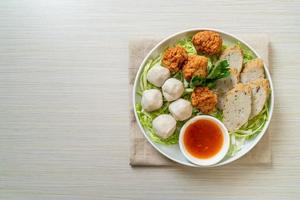 Boiled fish balls with shrimp balls and Chinese fish sausage photo