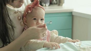 Mother feeds the baby with a spoon Mother concept video