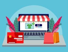 online shopping technology in laptop with credit card and bags vector